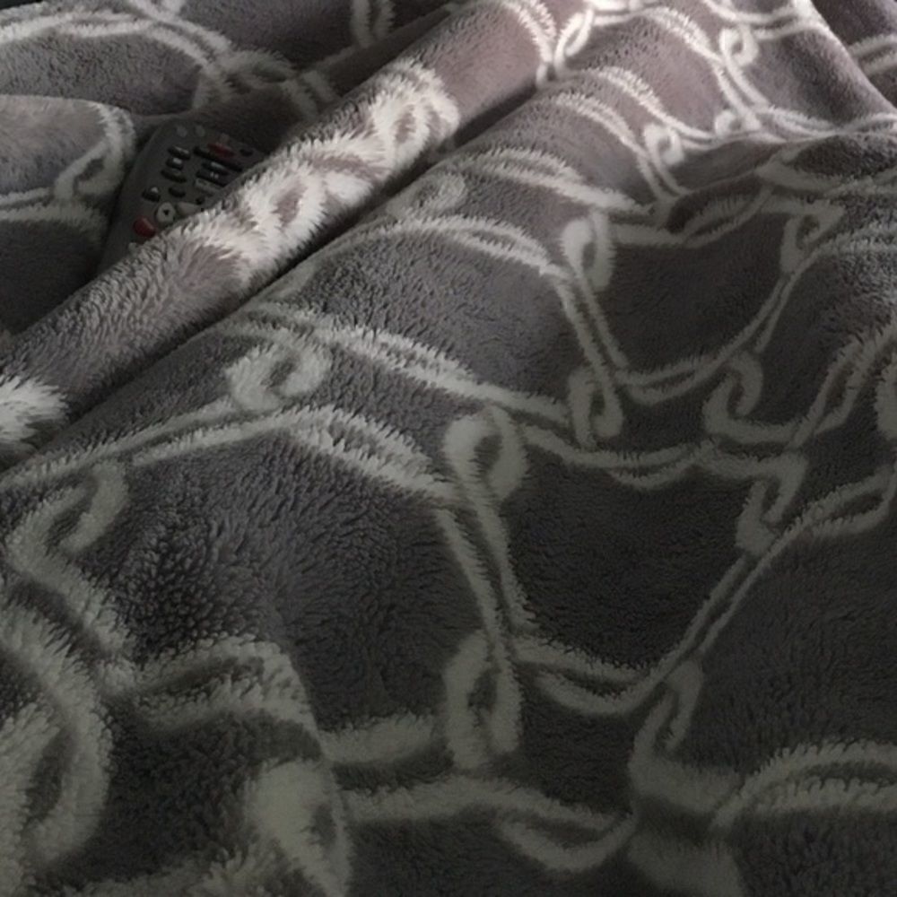 Gray and white fleeced blanket